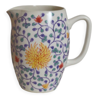 Hand-painted artisan pitcher with colorful patterns