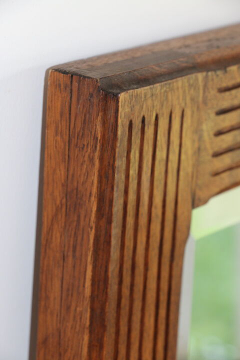 Beveled mirror grooved wood