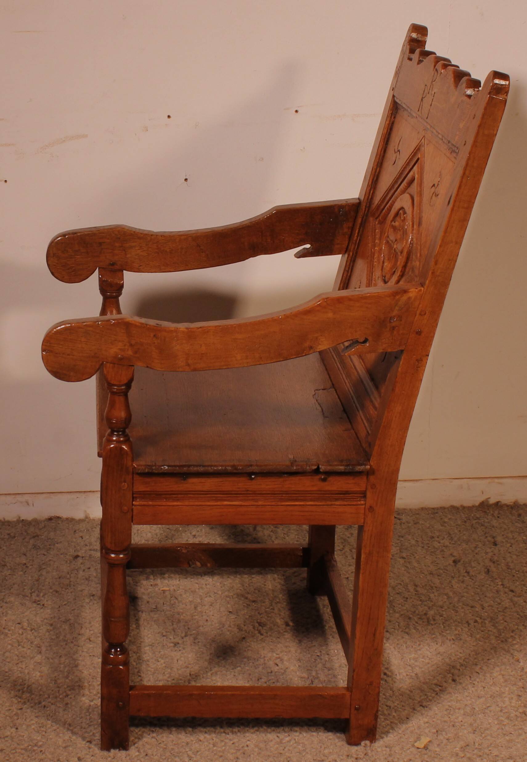high-backed armchair from the 17th century in oak