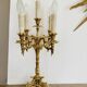Pair of gilt bronze chandeliers, marble bases.