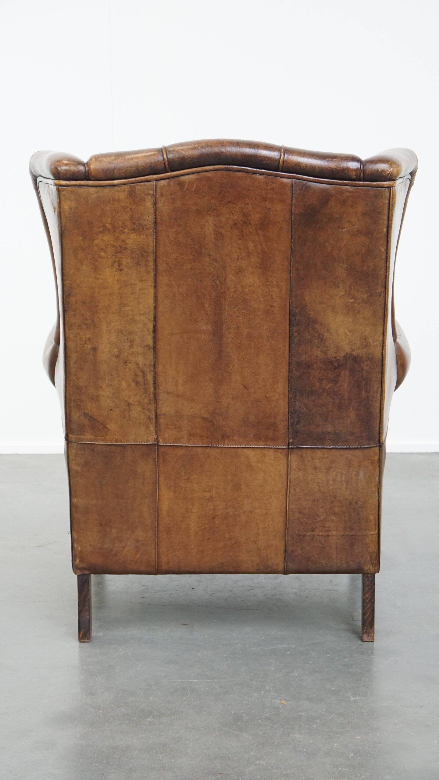 Sheepskin wingback chair in good condition
