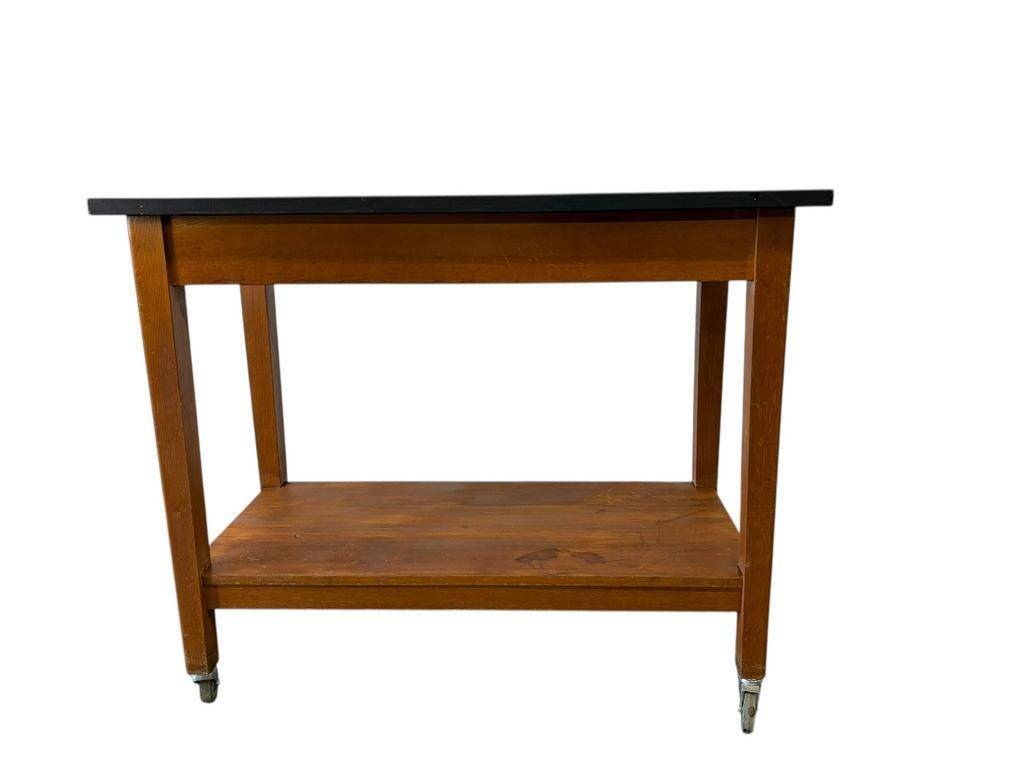 Vintage wooden high table on wheels