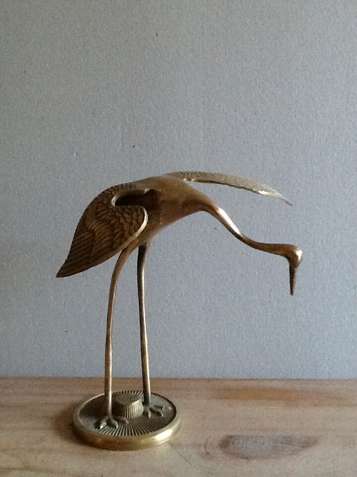 Bird takes off brass