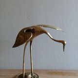 Bird takes off brass