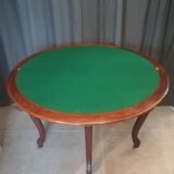 Half-moon mahogany game table on casters