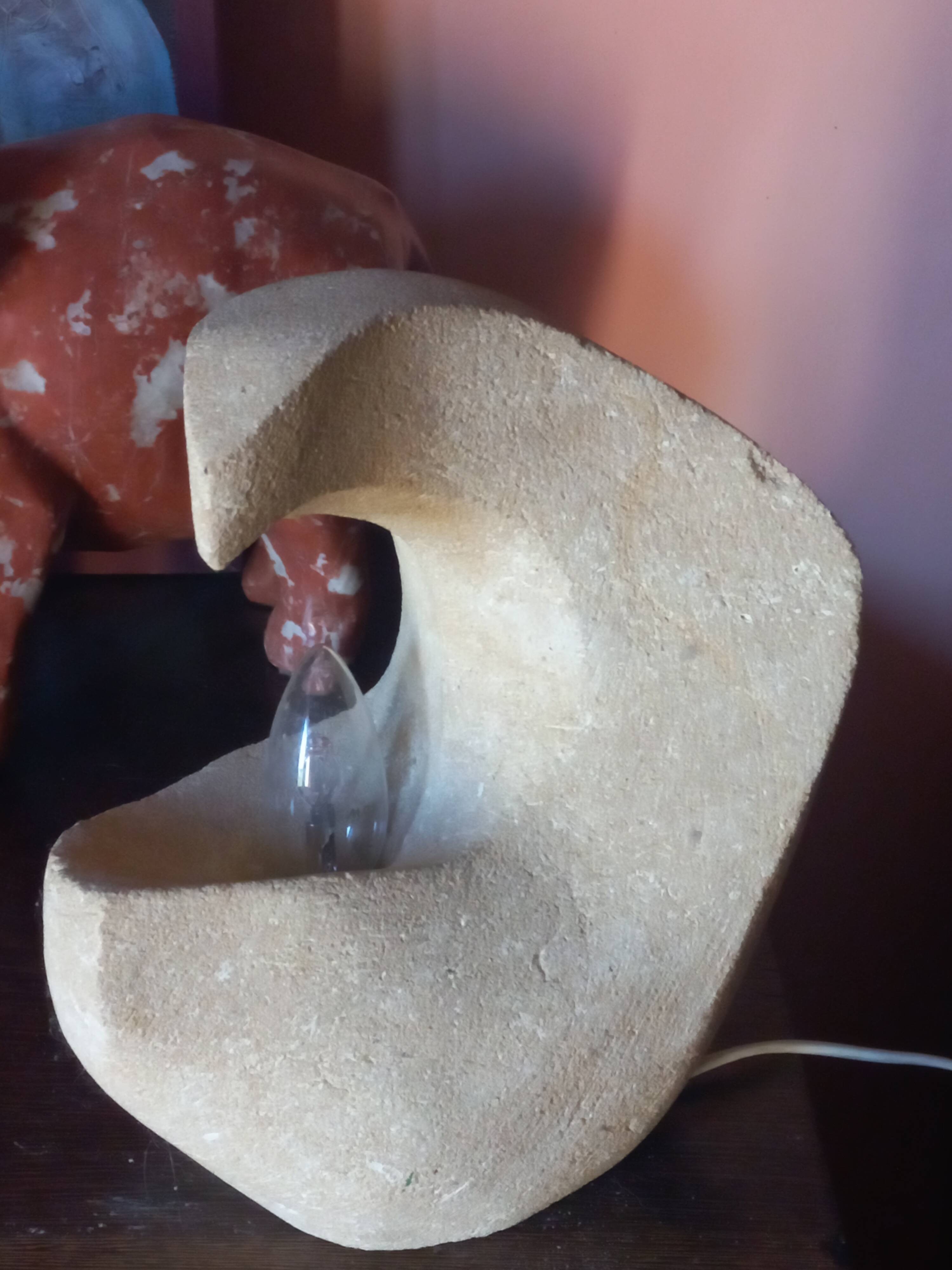 Sculpted stone lamp from the 1970s, signed.