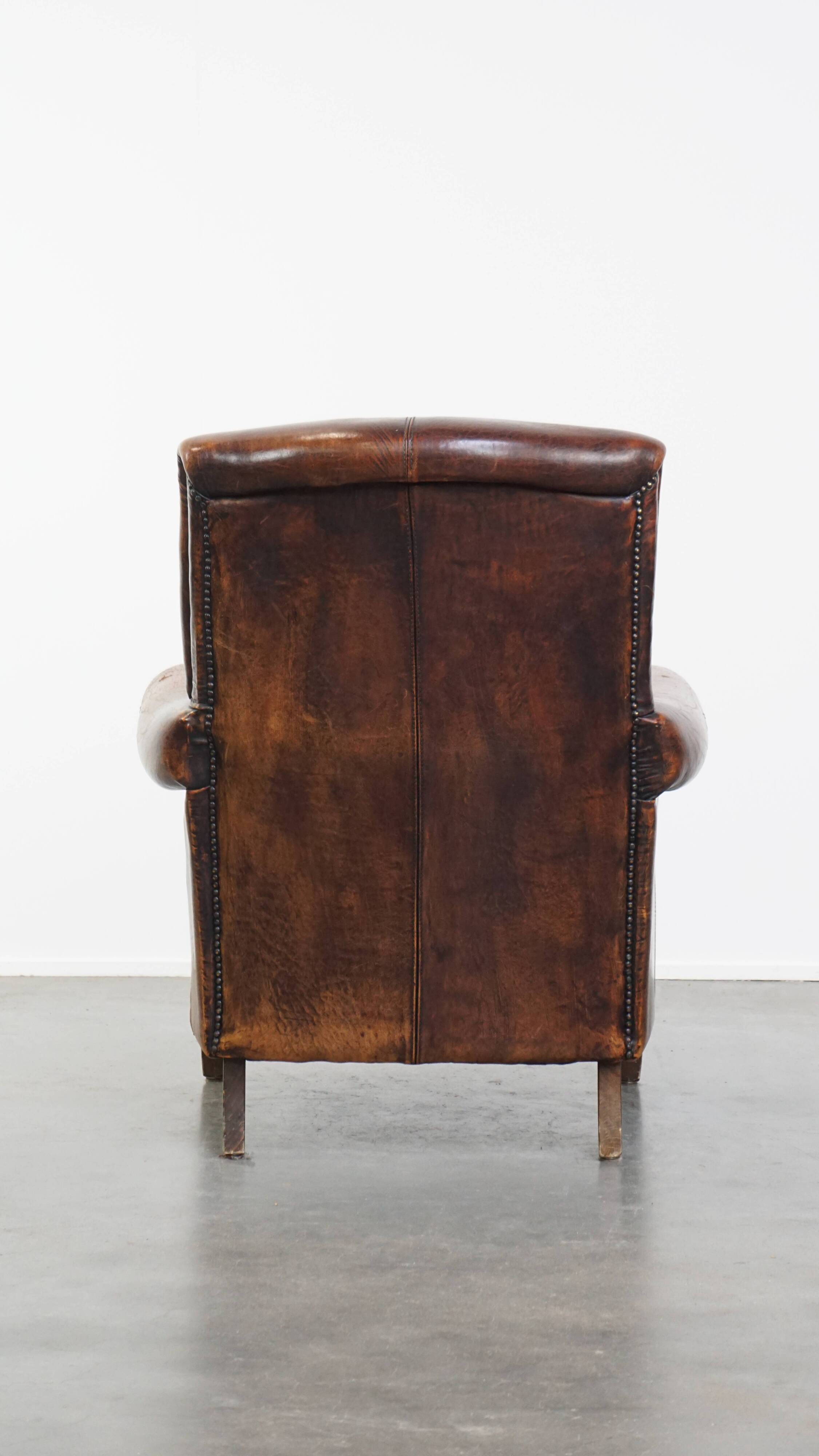 Fauteuil vintage en cuir de mouton avec dossier haut