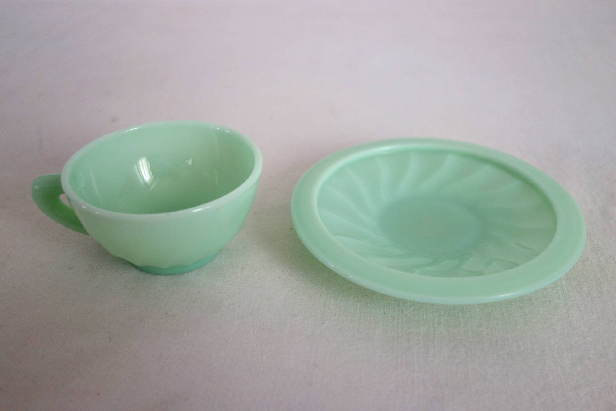 10 almond green opaline cups and saucers from the 50s