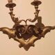 Paire de appliques murales antiques en bois doré du 19ème siècle.