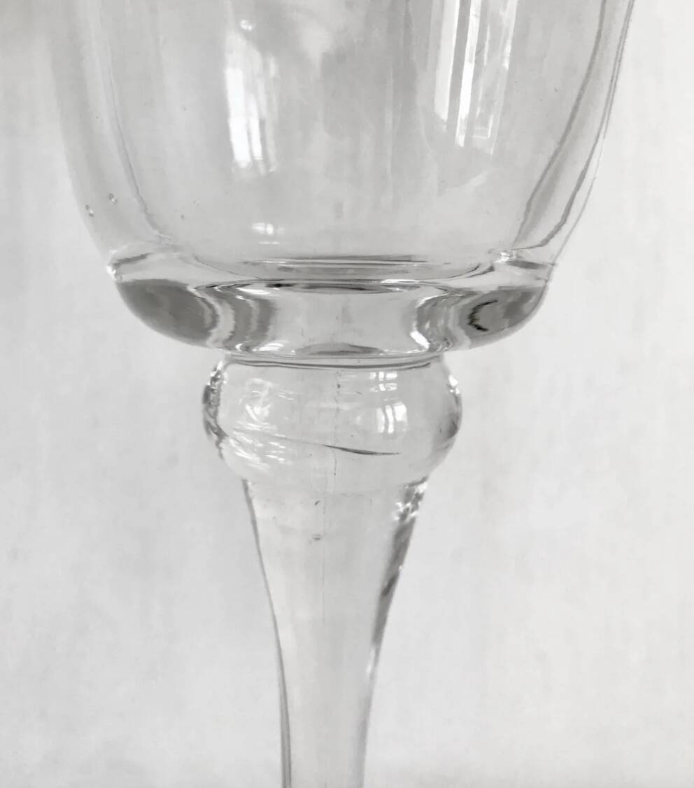 Pair of glass candlesticks on a stand