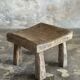 Small stool, square solid teak side table with a curved seat.