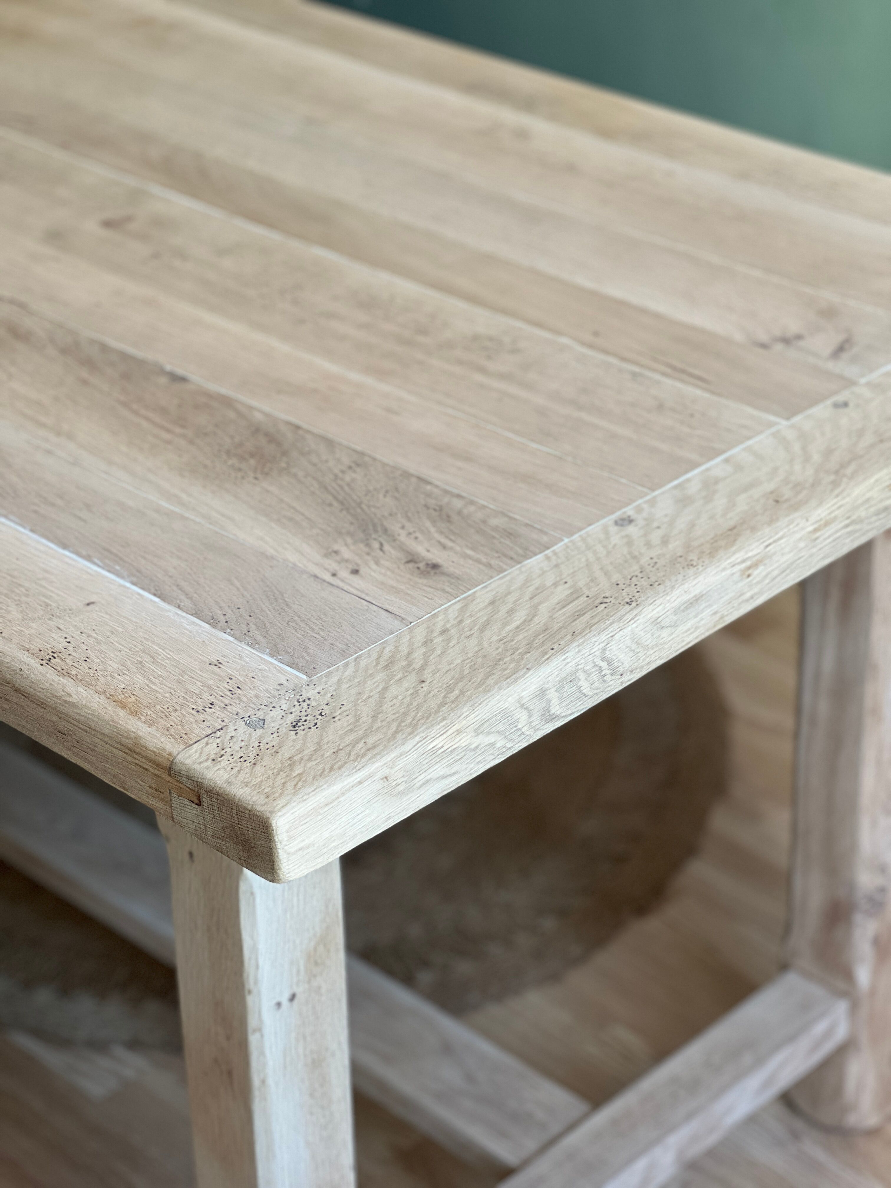 Farm table made of solid light oak wood.