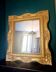 Grand miroir en bois doré