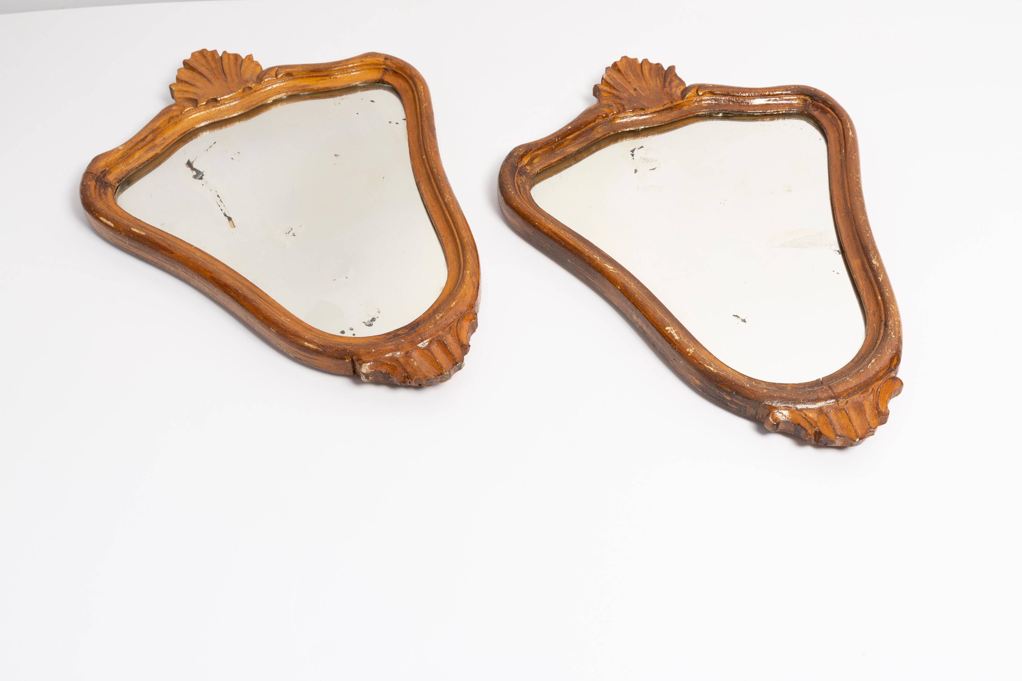 Pair of vintage Mid-Century decorative mirrors in a gold frame, Italy, 1960s.