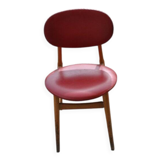 Vintage red office chair in faux leather and wood, 1960s Central European style.