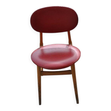 Vintage red office chair in faux leather and wood, 1960s Central European style.