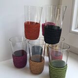 set of 9 small glasses with colored rattan support from the 70s