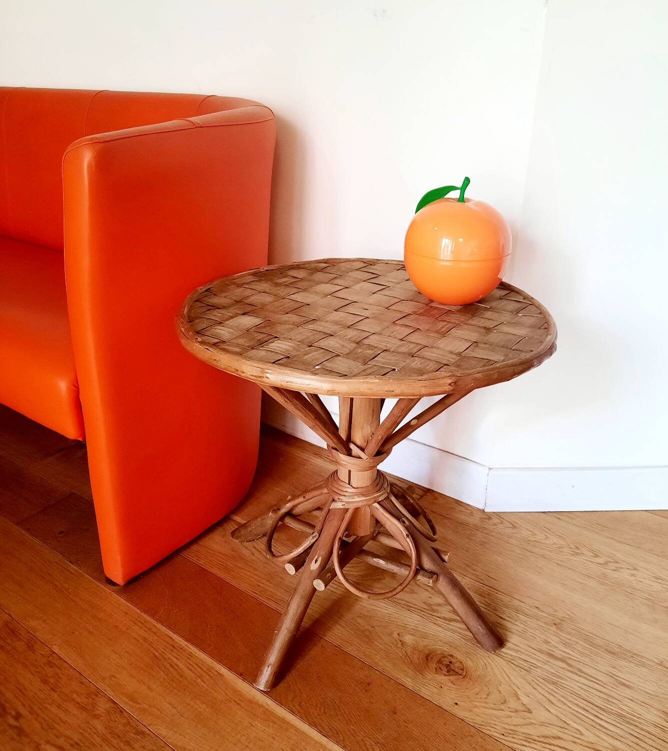 Old bamboo/rattan table with woven palm leaves.