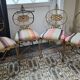 Four Gilbert Poillerat chairs