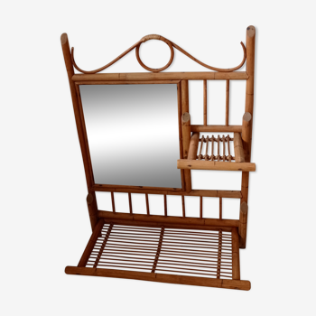 Old bamboo and rattan mirror with vintage folding shelves