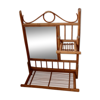 Old bamboo and rattan mirror with vintage folding shelves