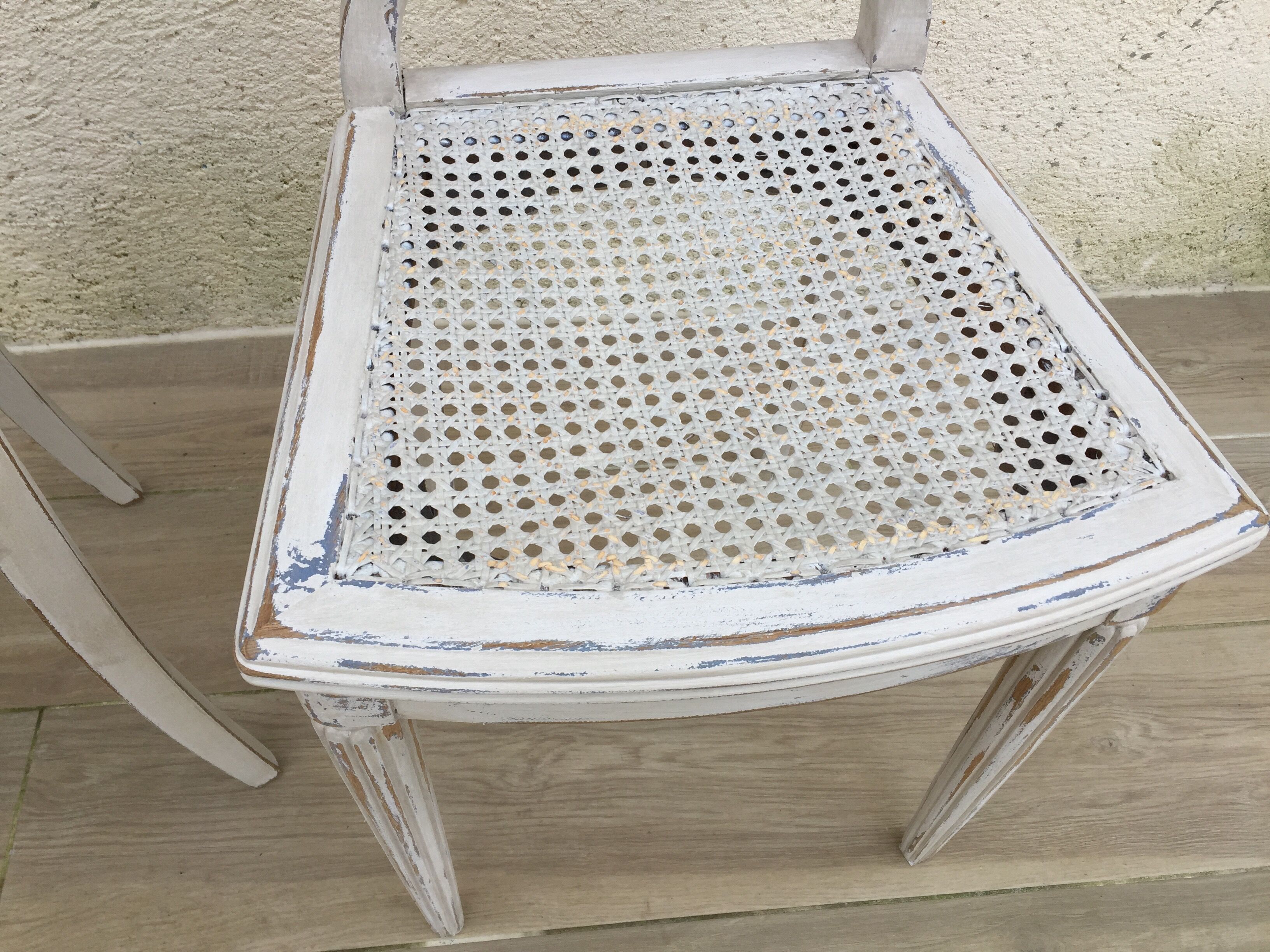 Pair of old white canne chairs