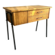 Vintage 1950s sewing machine with blonde oak veneer.