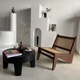 Reclined armchair in canned teak in natural wood
