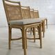 Suite de 4 chaises en rotin cannage et laiton