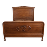 Lit double ancien en bois sculpté