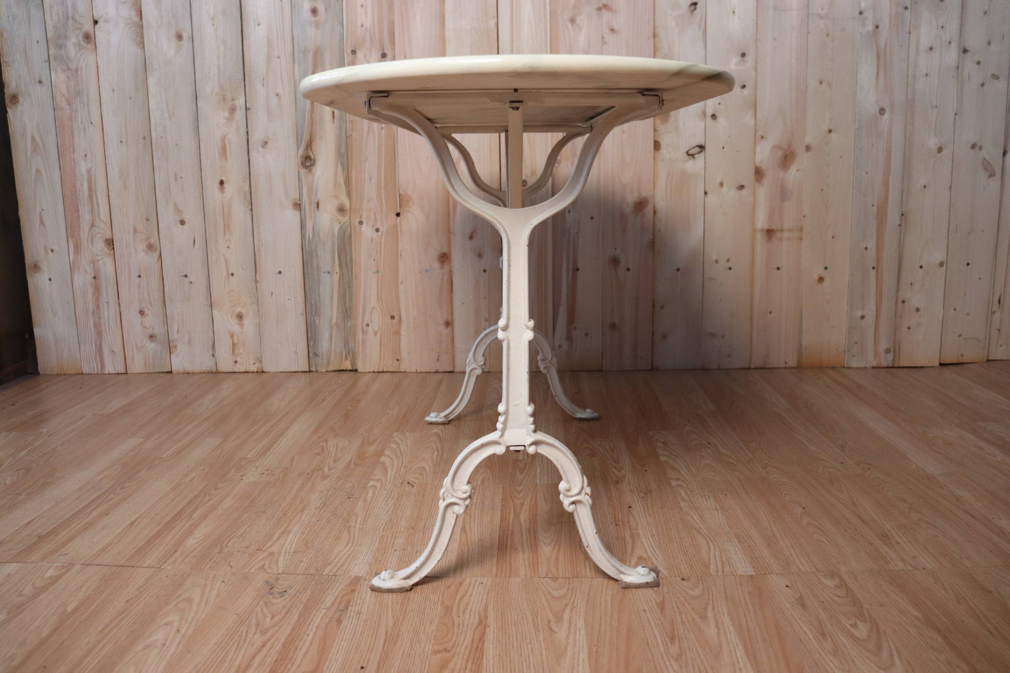 Bistro table with marble tray and wrought iron feet
