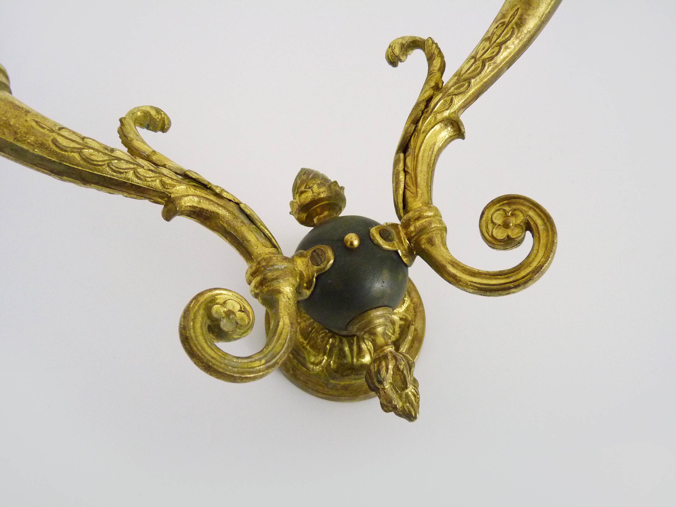 Pair of double-light Empire style wall lights in bronze