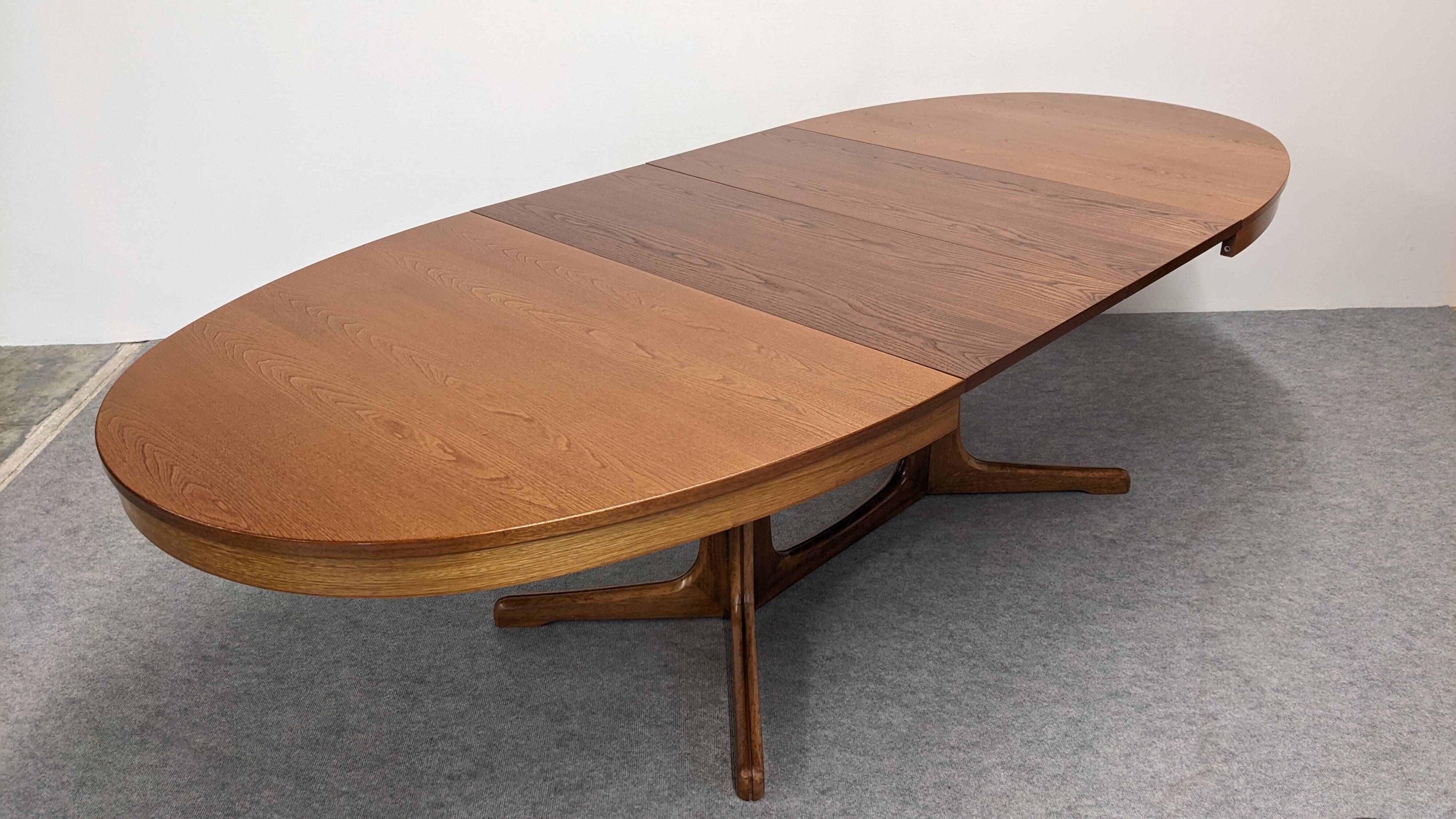 Oval extendable dining table by Baumann, France circa 1970.