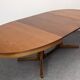 Oval extendable dining table by Baumann, France circa 1970.