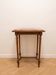 Classic wooden console with veined marble top.