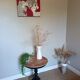 Marquetry pedestal table with black legs
