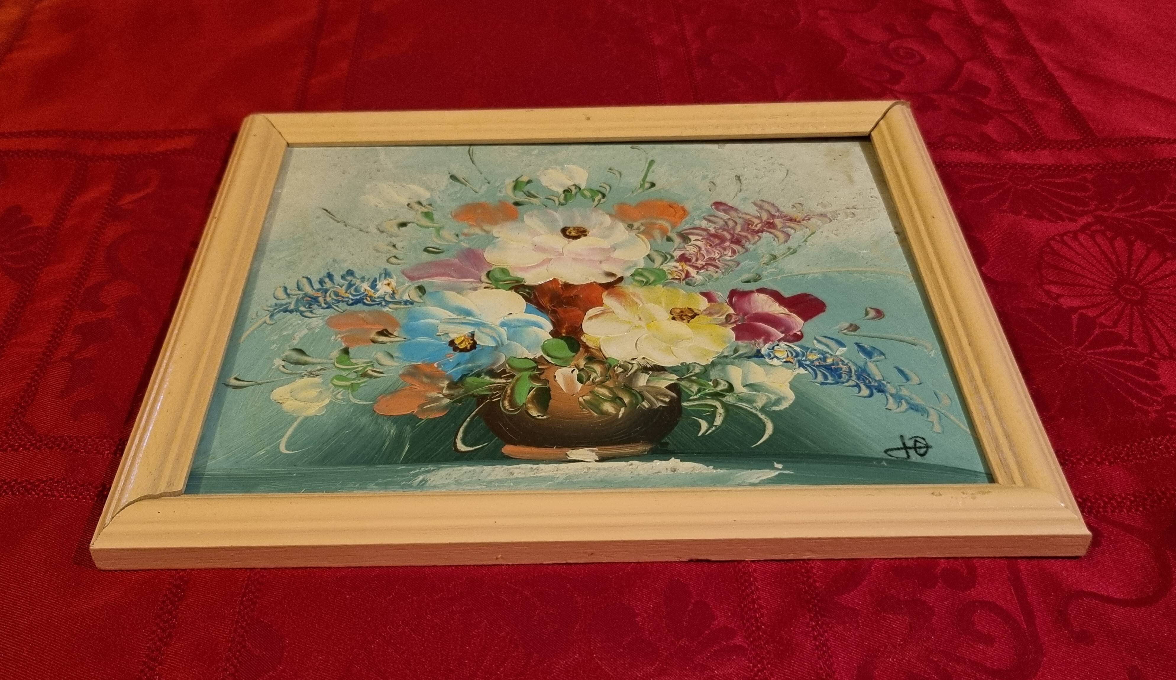 Oil painting of a bouquet of flowers.