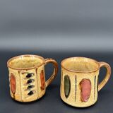 Pair of glazed stoneware mugs — abstract decor from the 70s