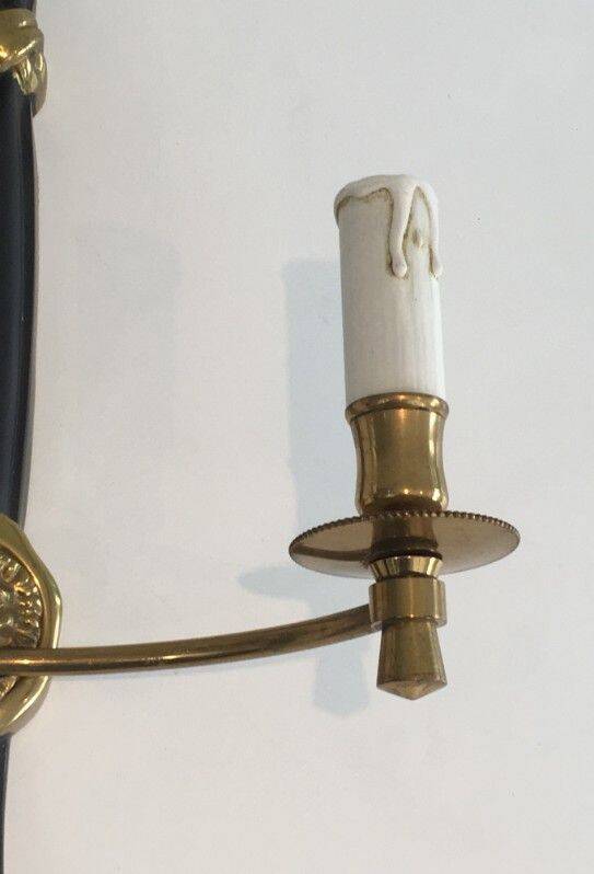 Pair of black lacquered bronze wall sconces decorated with lion heads