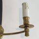 Pair of black lacquered bronze wall sconces decorated with lion heads