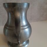 Tin pitcher with handle and spout