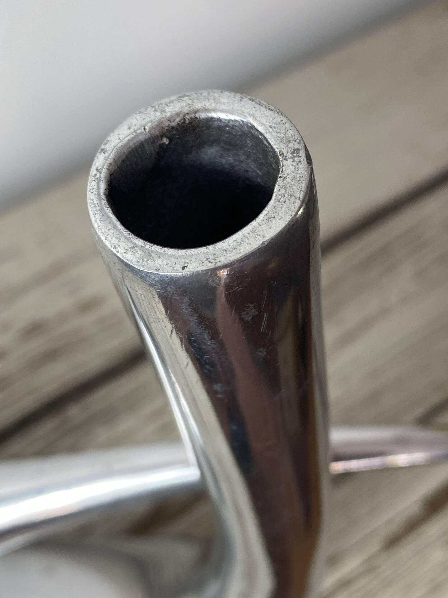Sculptural vase design in polished aluminium.