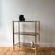 Brass and smoked glass library shelves