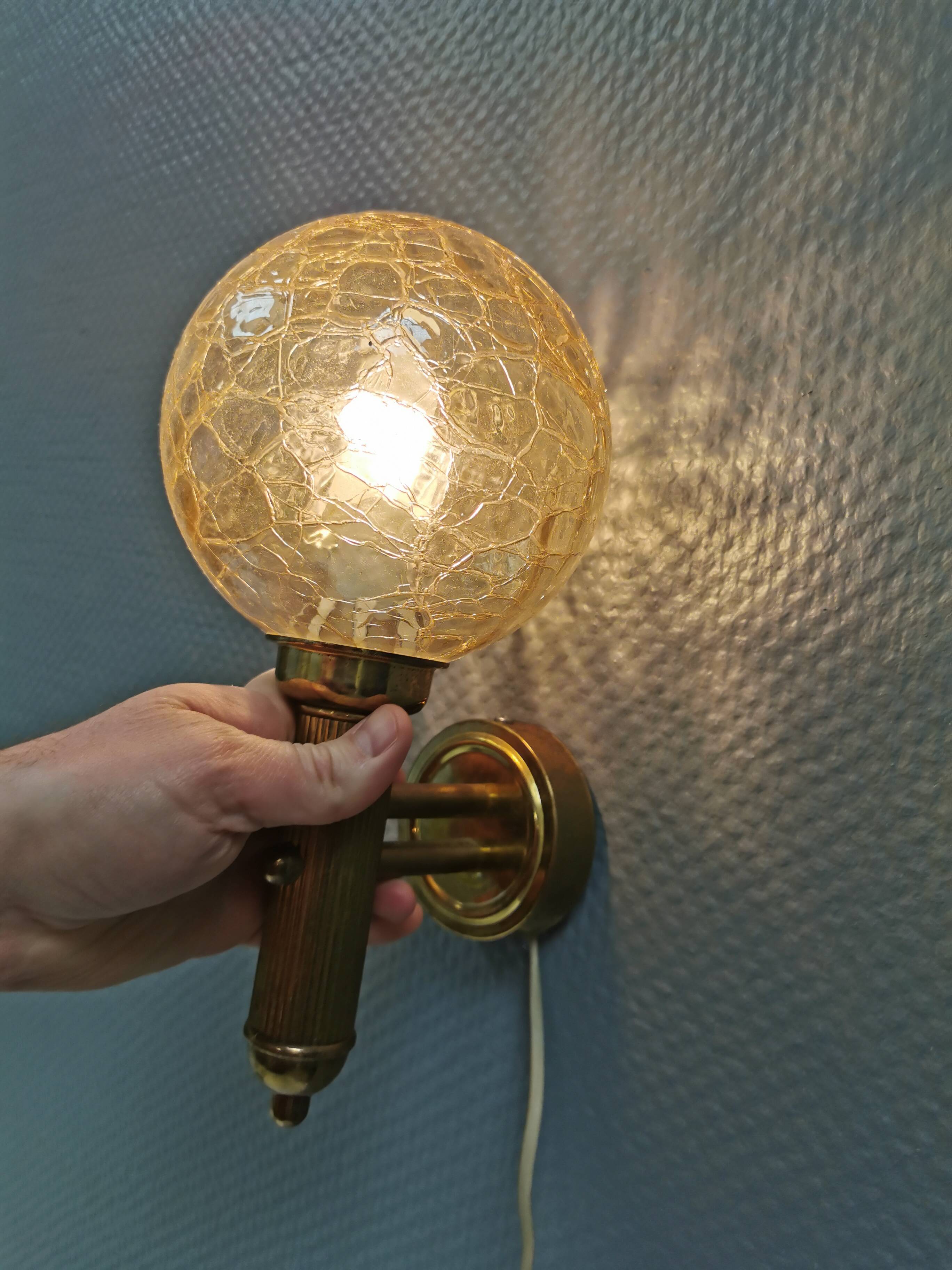 Older wall lamp in metal, brass and “cracked” glass.