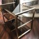 Vintage brass serving trolley with smoked glass trays.
