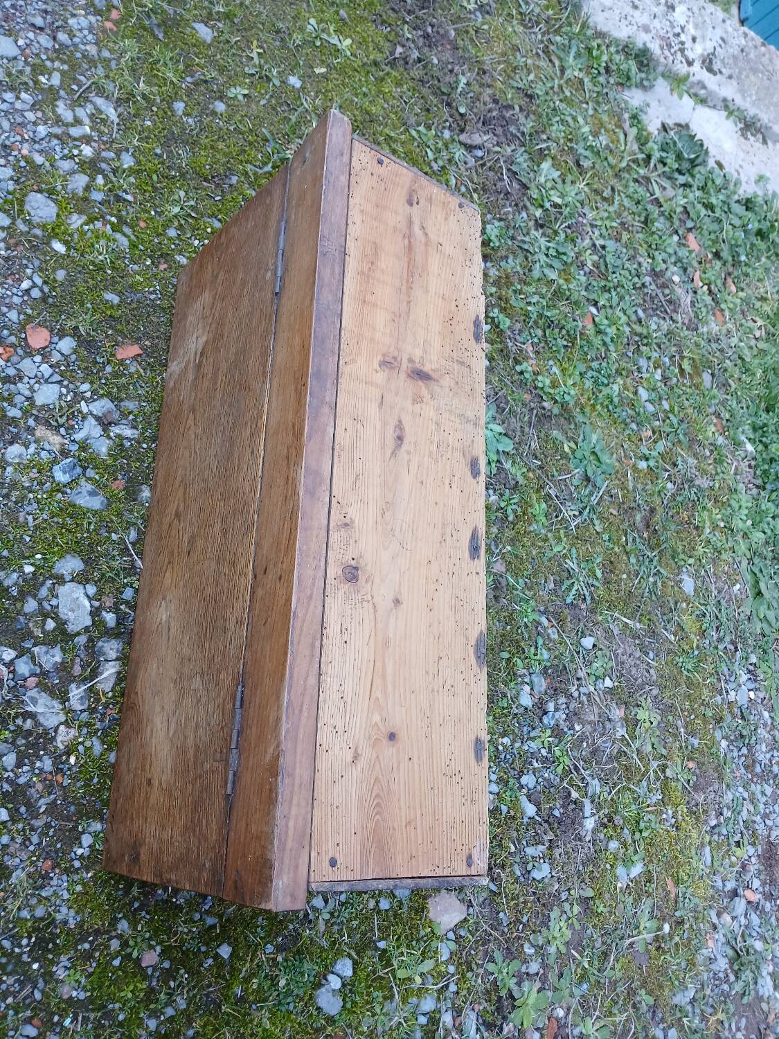 Small old wooden chest with hinged lid