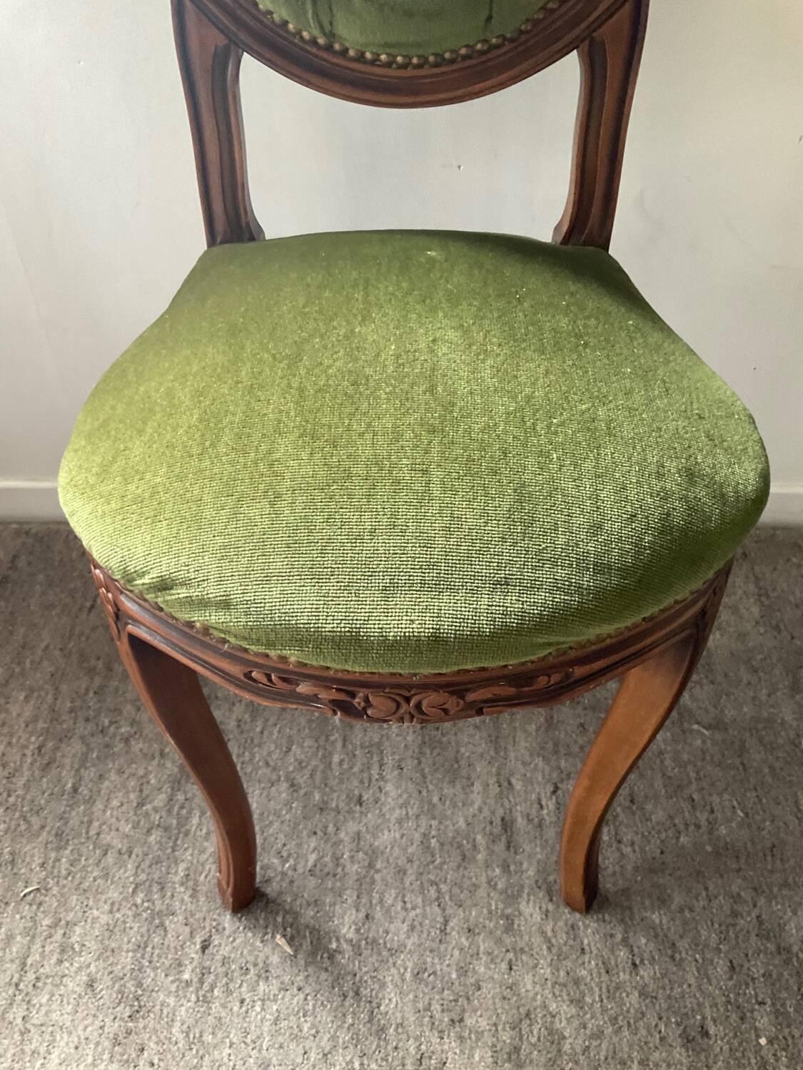 Antique wooden and velvet upholstered chair