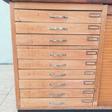 Workshop furniture with drawers and curtain in beech and walnut.