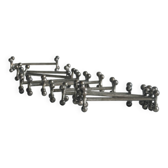 Set of 11 metal knife holders.