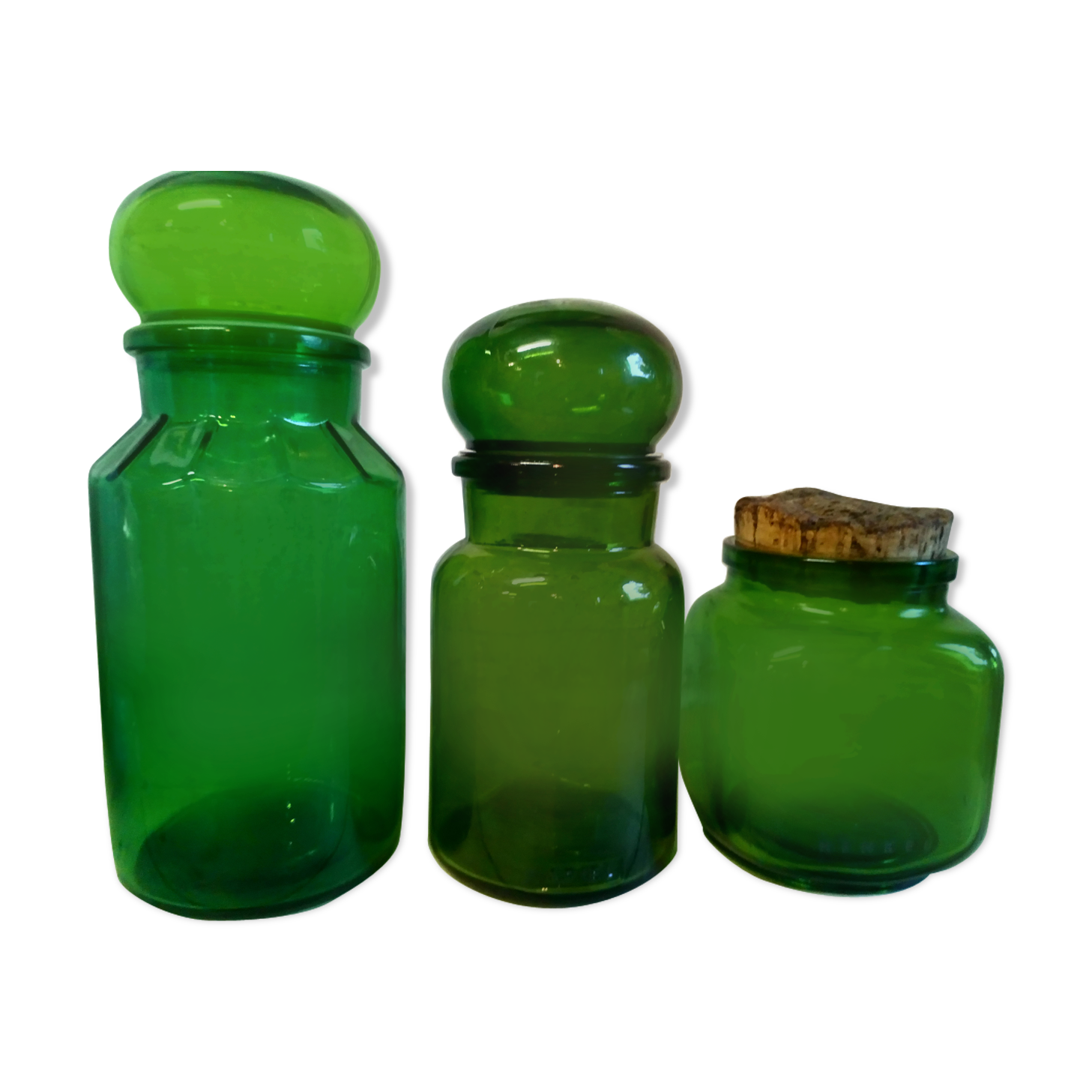 Trio of green glass apothecary bottles